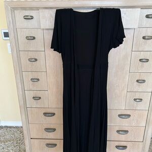 Long black bathing suit cover-up. Wrap Skirt 100% Rayon. Wore nice.